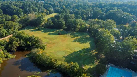 a view of a lake with green space