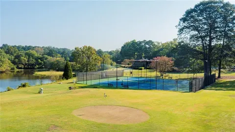 a view of an outdoor space and tennis court