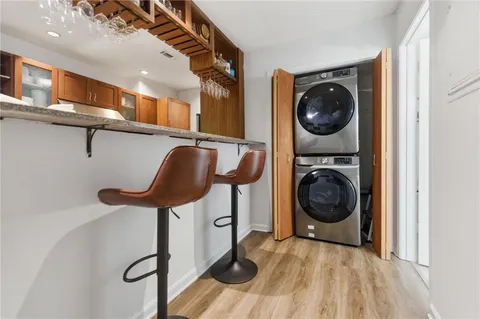 a view of a hallway with washer and dryer