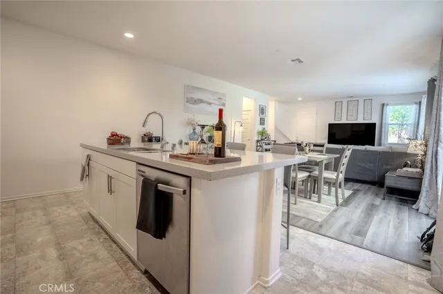 a living room with furniture a wooden floor and a fireplace