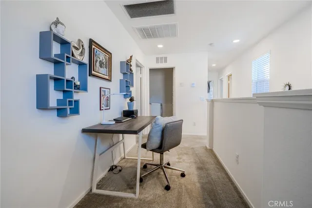 a bathroom with a toilet and a shower curtain