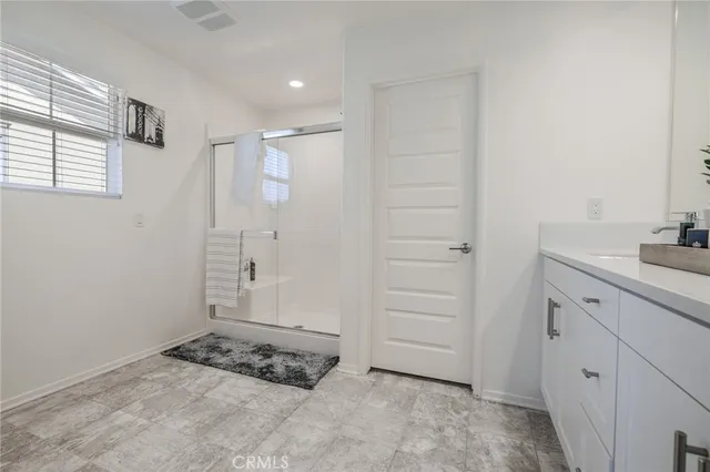 a white toilet sitting next to a bath tub