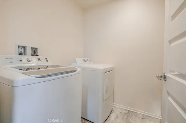 a view of a roof deck with furniture