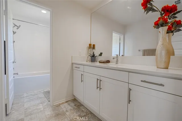 a row of palm trees and swimming pool in the backyard of a building