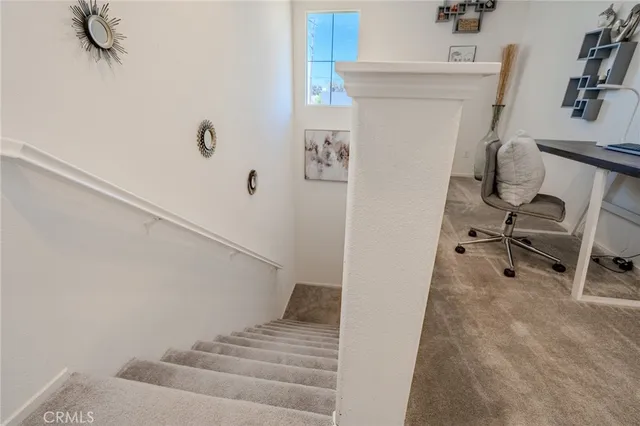 an aerial view of a house with a swimming pool