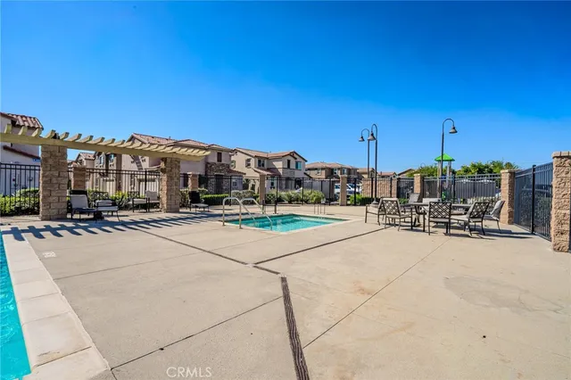 an aerial view of multiple houses with yard