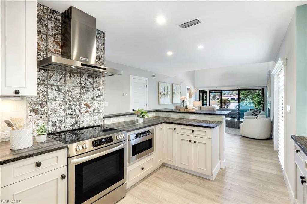 15455 Royal Fern Lane North, Unit 22B Naples, FL 34110 - Photo 11 of 37 Granite counters with leather finish