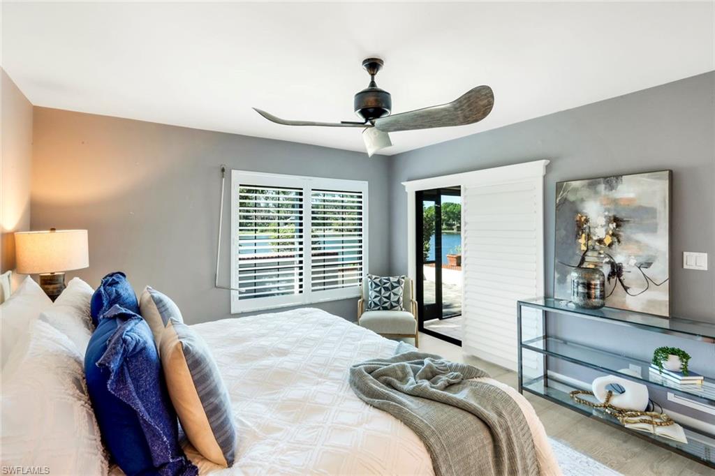 15455 Royal Fern Lane North, Unit 22B Naples, FL 34110 - Photo 20 of 37 Primary bedroom with door to lanai
