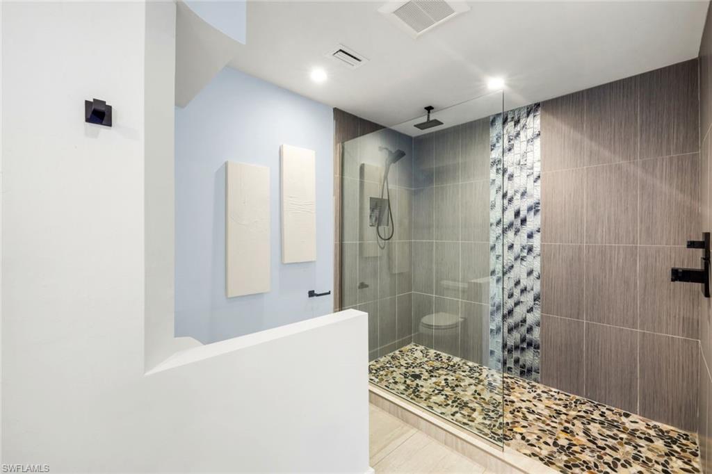 15455 Royal Fern Lane North, Unit 22B Naples, FL 34110 - Photo 21 of 37 Primary bathroom; huge shower and walk-in closet