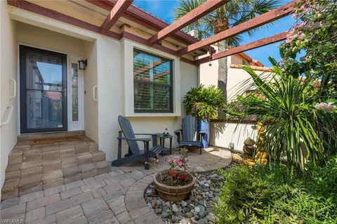 a backyard of a house with seating space