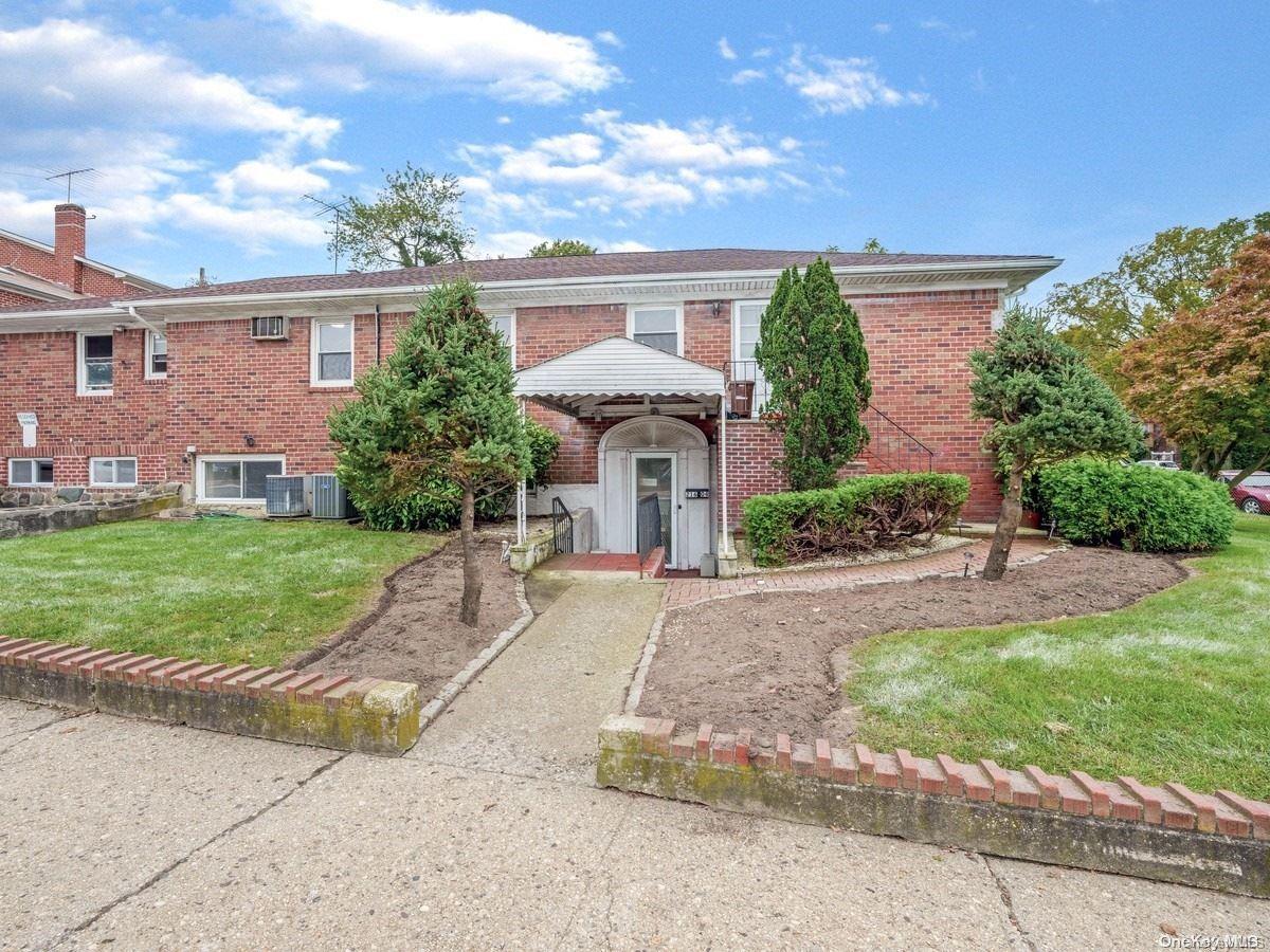 80-03 Bell Boulevard Queens, NY 11427 - Photo 1 of 1 a front view of a house with a yard