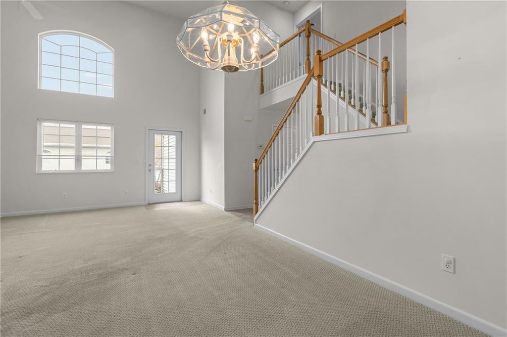 68 Nicholas Drive Beaver, PA 15009 - Photo 11 of 24 a view of an empty room with chandelier fan and wooden floor