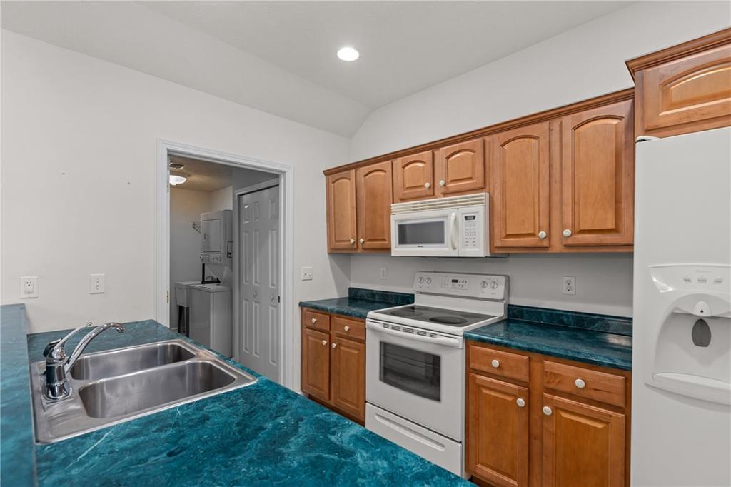 68 Nicholas Drive Beaver, PA 15009 - Photo 12 of 24 a kitchen that has a sink a stove and a microwave oven in it