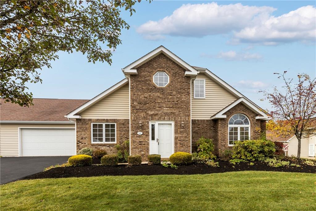 68 Nicholas Drive Beaver, PA 15009 - Photo 2 of 24 a front view of a house with a garden and plants