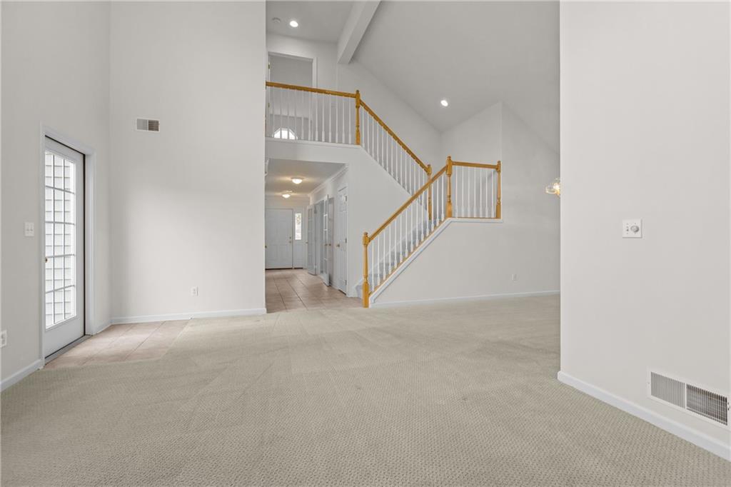 68 Nicholas Drive Beaver, PA 15009 - Photo 9 of 24 a view of an empty room with stairs