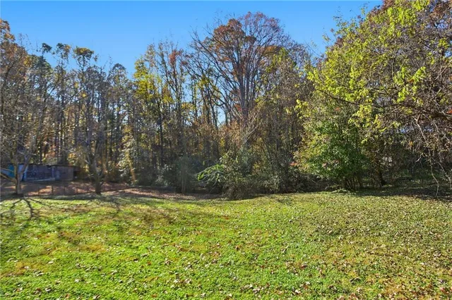 a view of outdoor space with deck and yard
