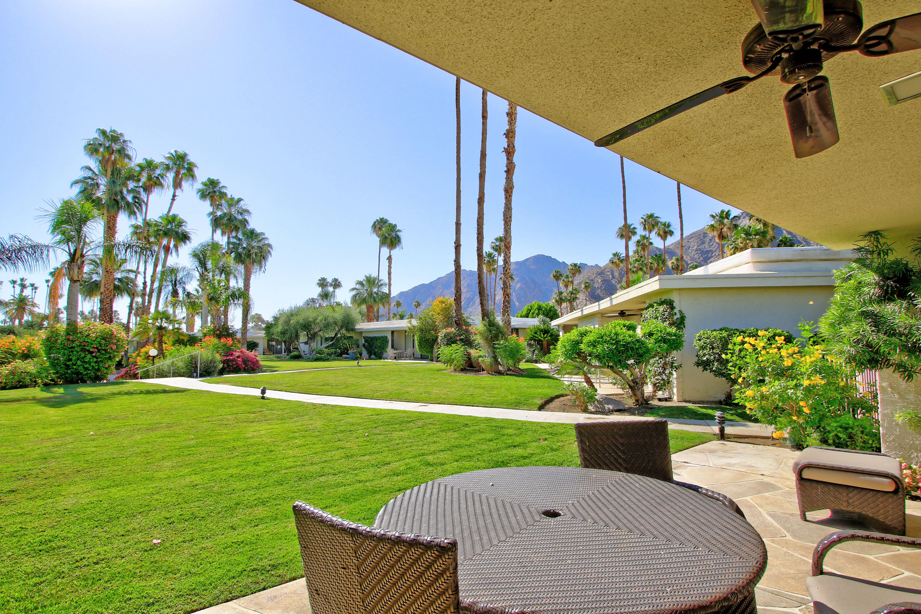 45760 Pawnee Road Indian Wells, CA 92210 - Photo 1 of 56 a swimming pool with outdoor seating and yard