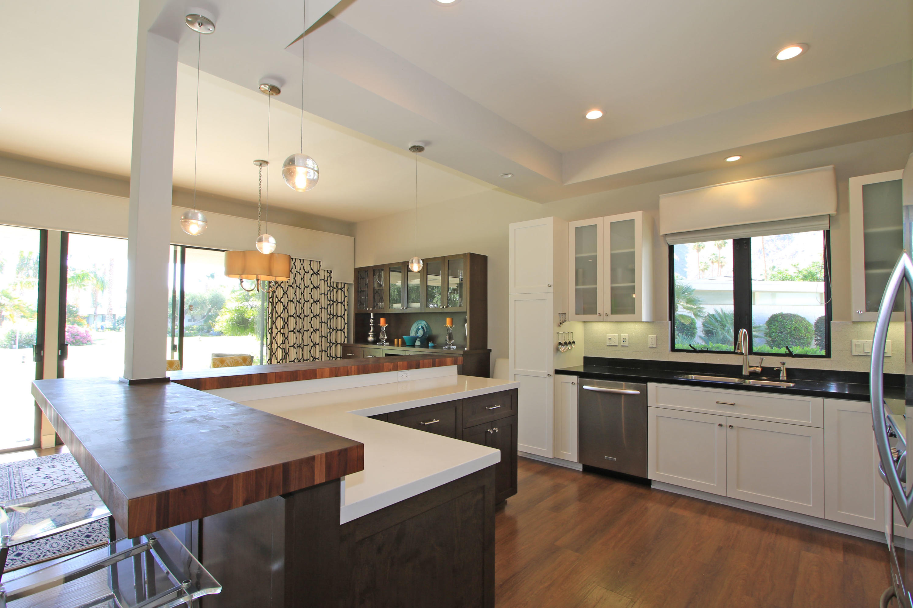 45760 Pawnee Road Indian Wells, CA 92210 - Photo 15 of 56 a large kitchen with kitchen island a sink table and chairs
