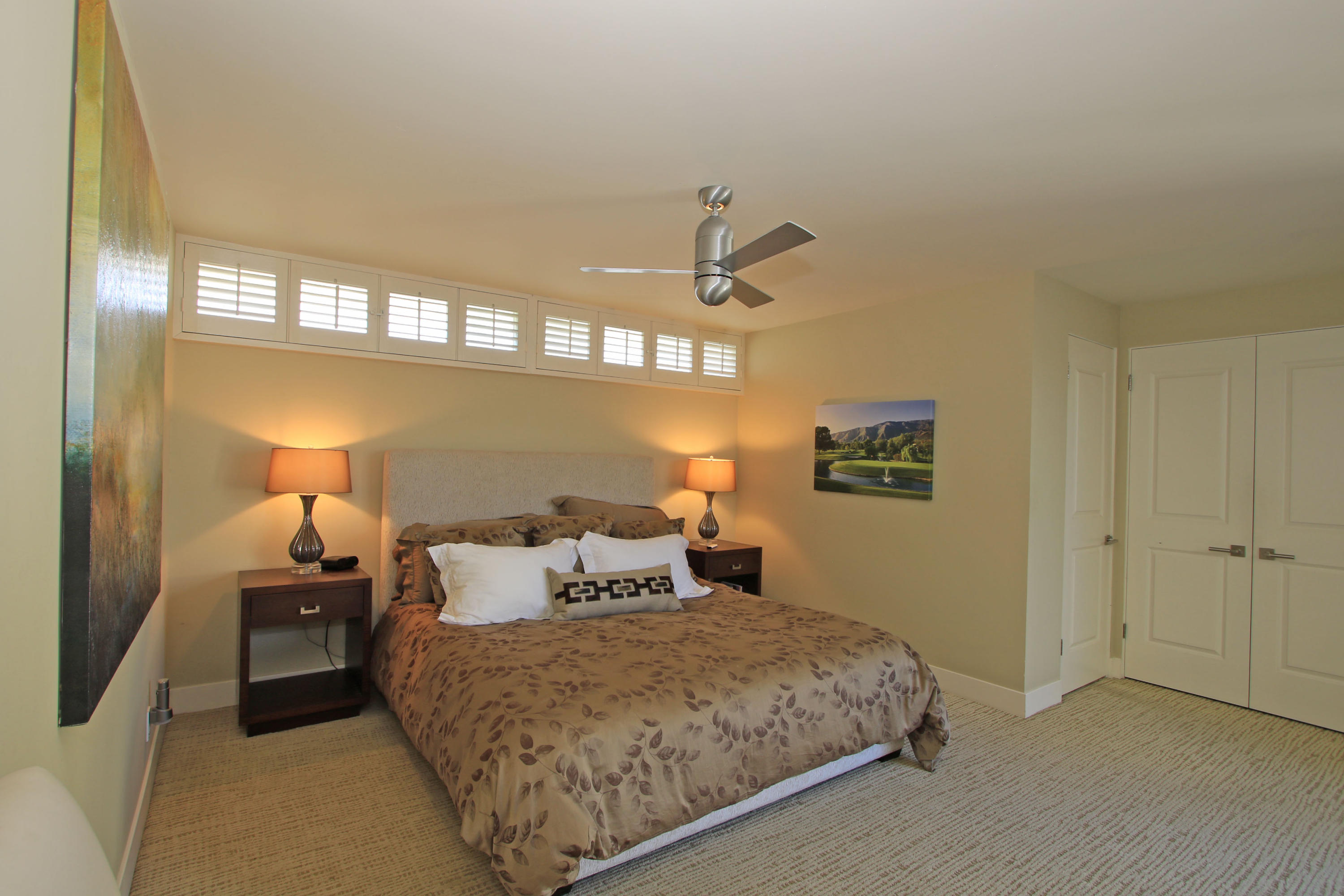 45760 Pawnee Road Indian Wells, CA 92210 - Photo 24 of 56 a bedroom with a bed and window
