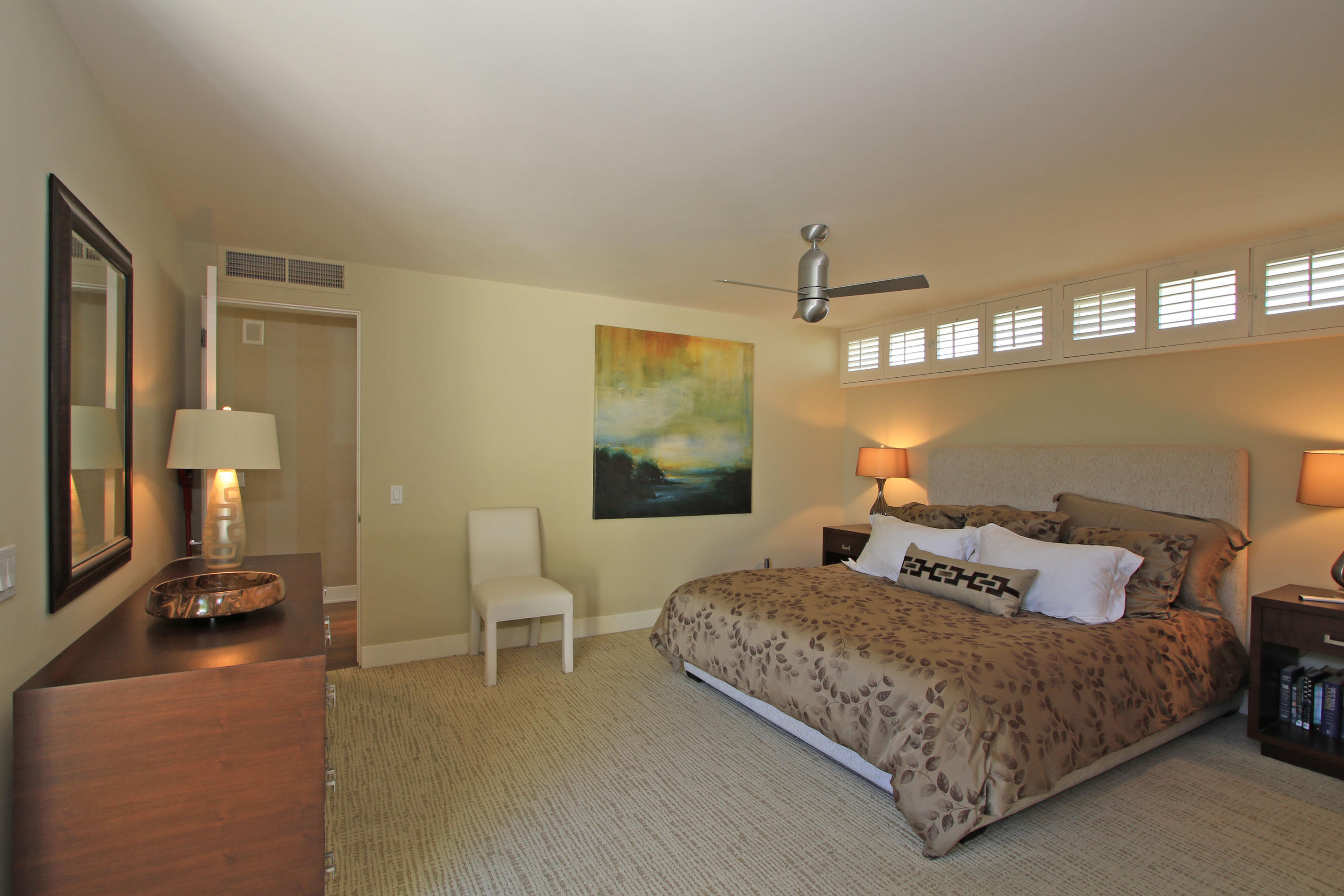 45760 Pawnee Road Indian Wells, CA 92210 - Photo 25 of 56 a bedroom with a bed and wooden floor