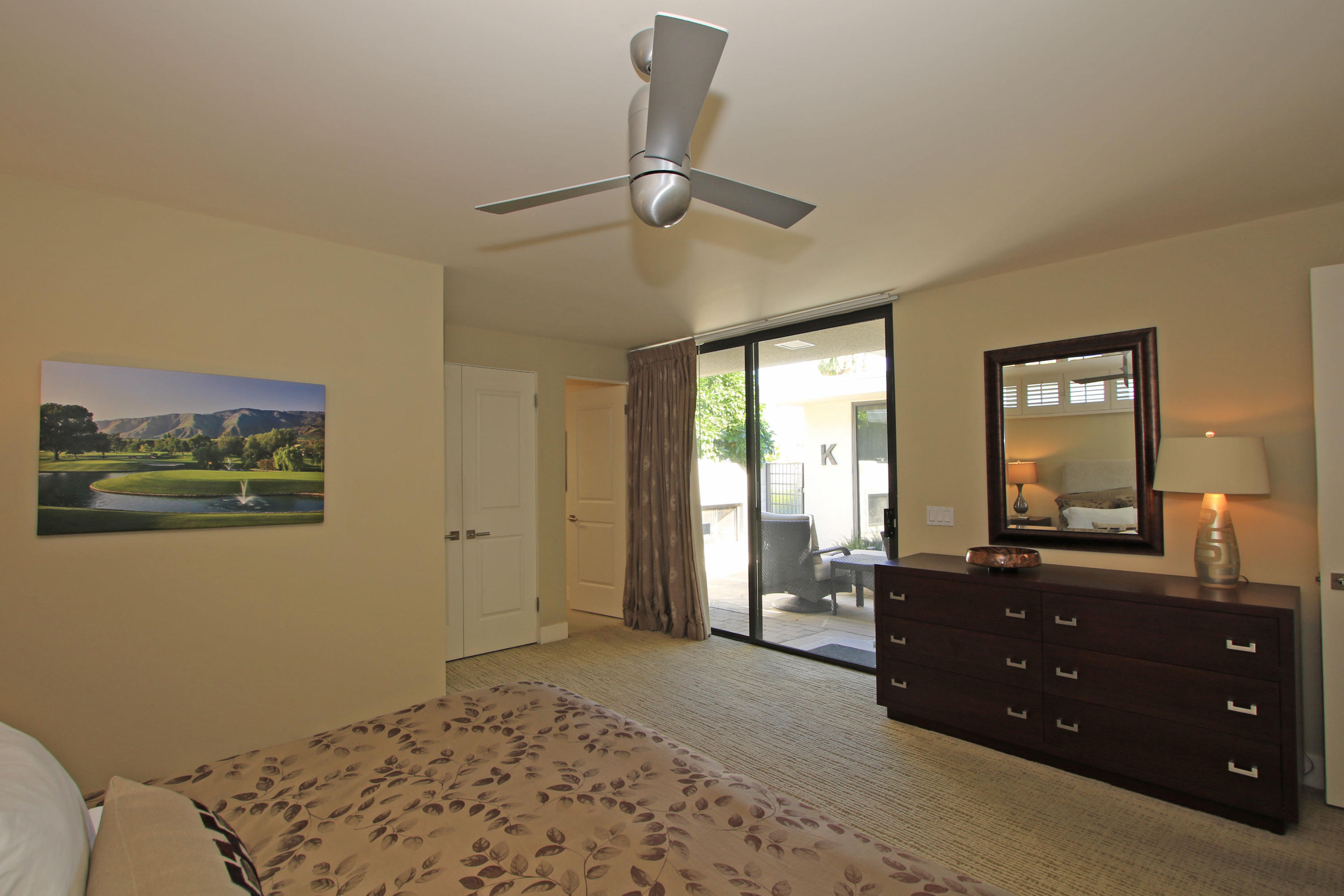 45760 Pawnee Road Indian Wells, CA 92210 - Photo 26 of 56 a bedroom with a bed and a dresser