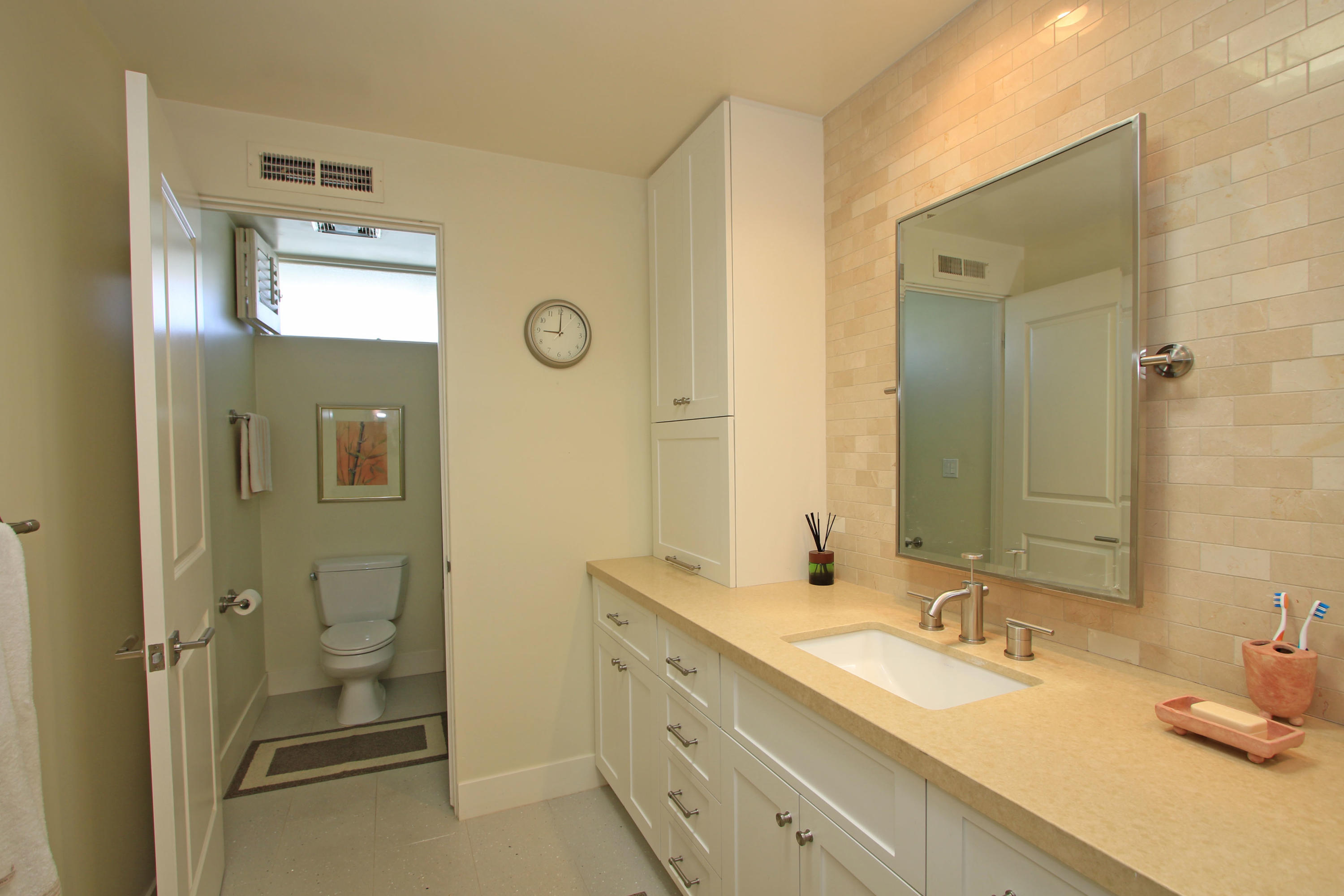 45760 Pawnee Road Indian Wells, CA 92210 - Photo 27 of 56 a bathroom with a double vanity sink mirror and shower
