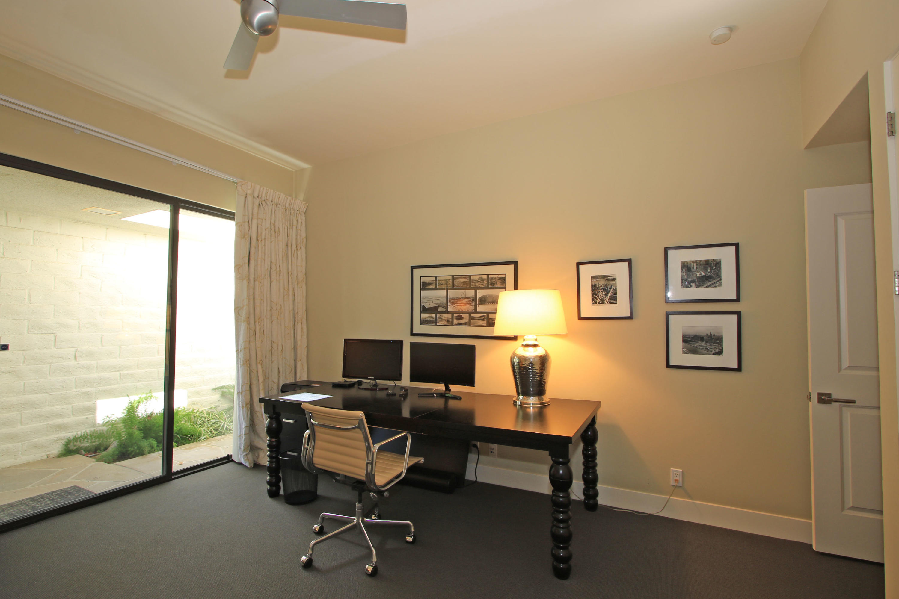 45760 Pawnee Road Indian Wells, CA 92210 - Photo 36 of 56 a view of a workspace with furniture and a window
