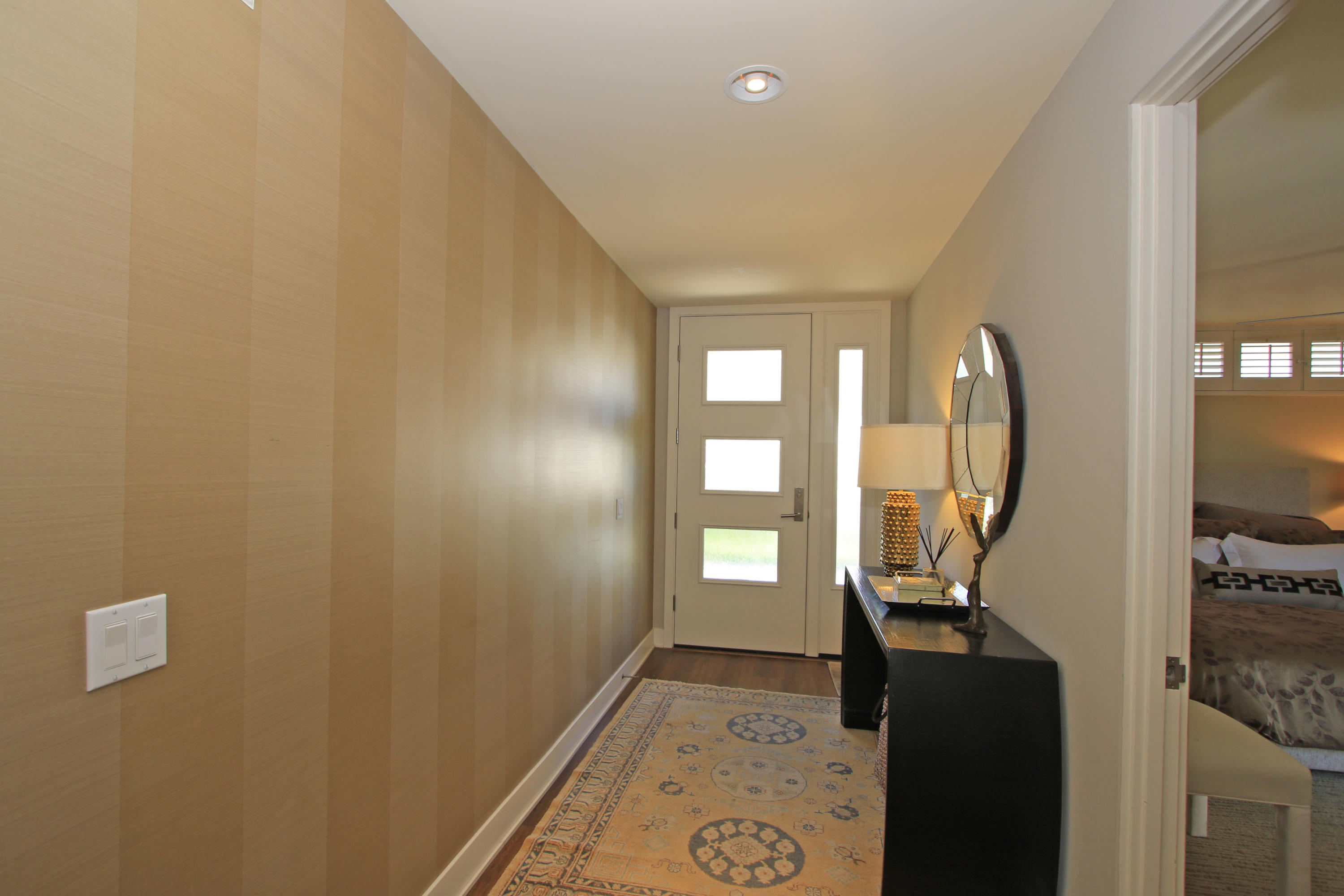 45760 Pawnee Road Indian Wells, CA 92210 - Photo 5 of 56 a view of a hallway with windows and stairs