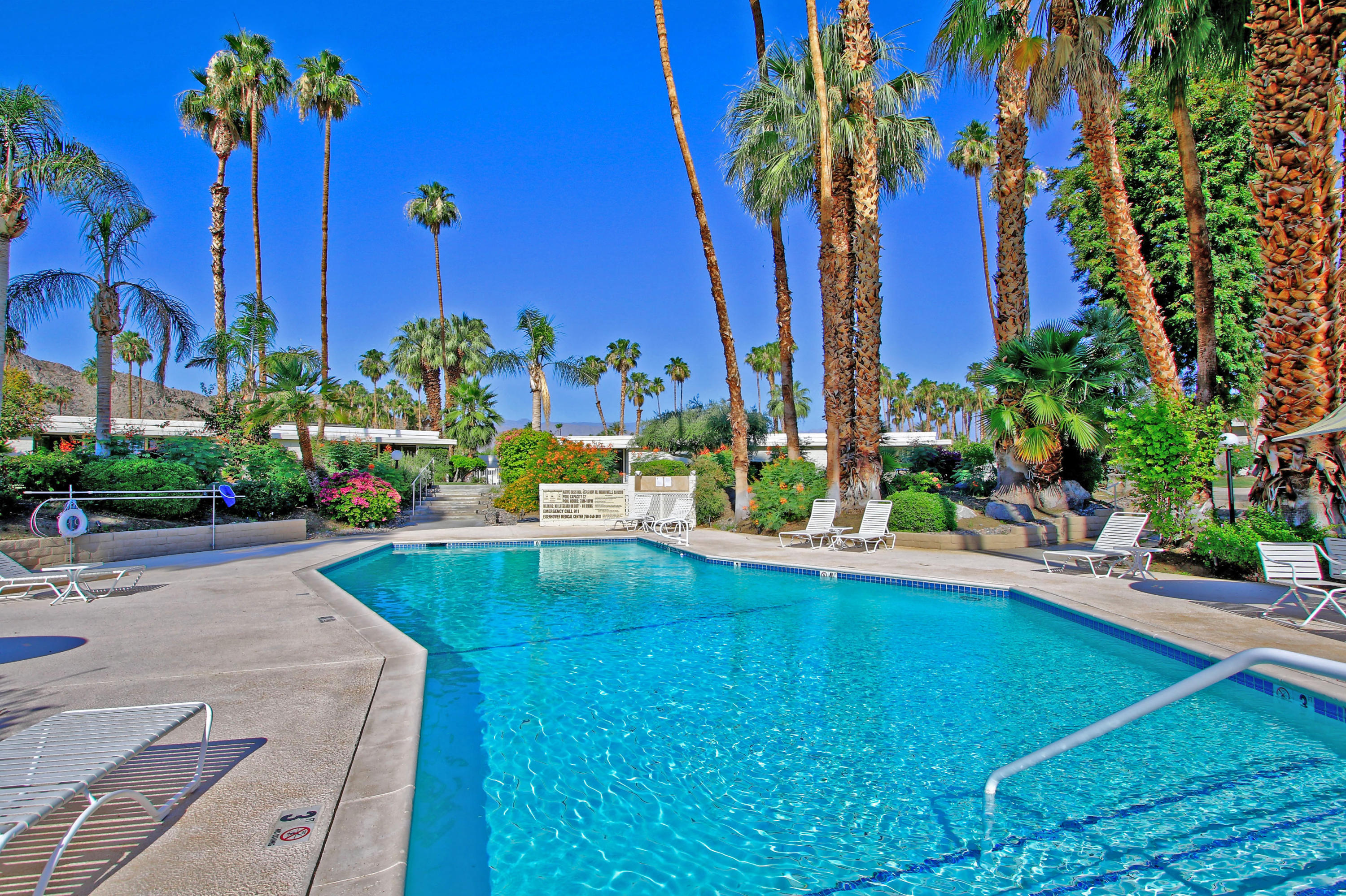 45760 Pawnee Road Indian Wells, CA 92210 - Photo 52 of 56 a view of a swimming pool with a patio