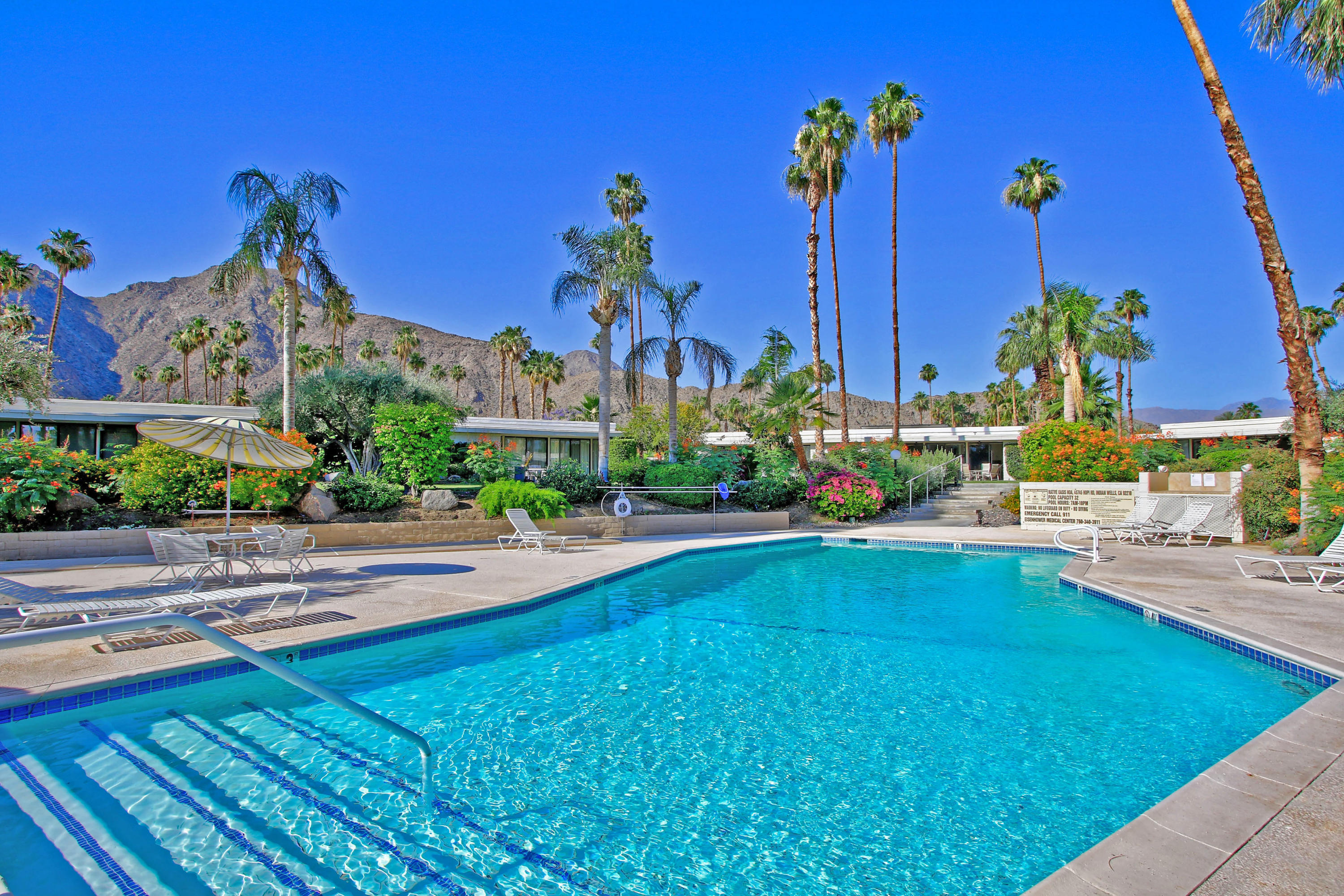 45760 Pawnee Road Indian Wells, CA 92210 - Photo 53 of 56 a view of a house with a swimming pool