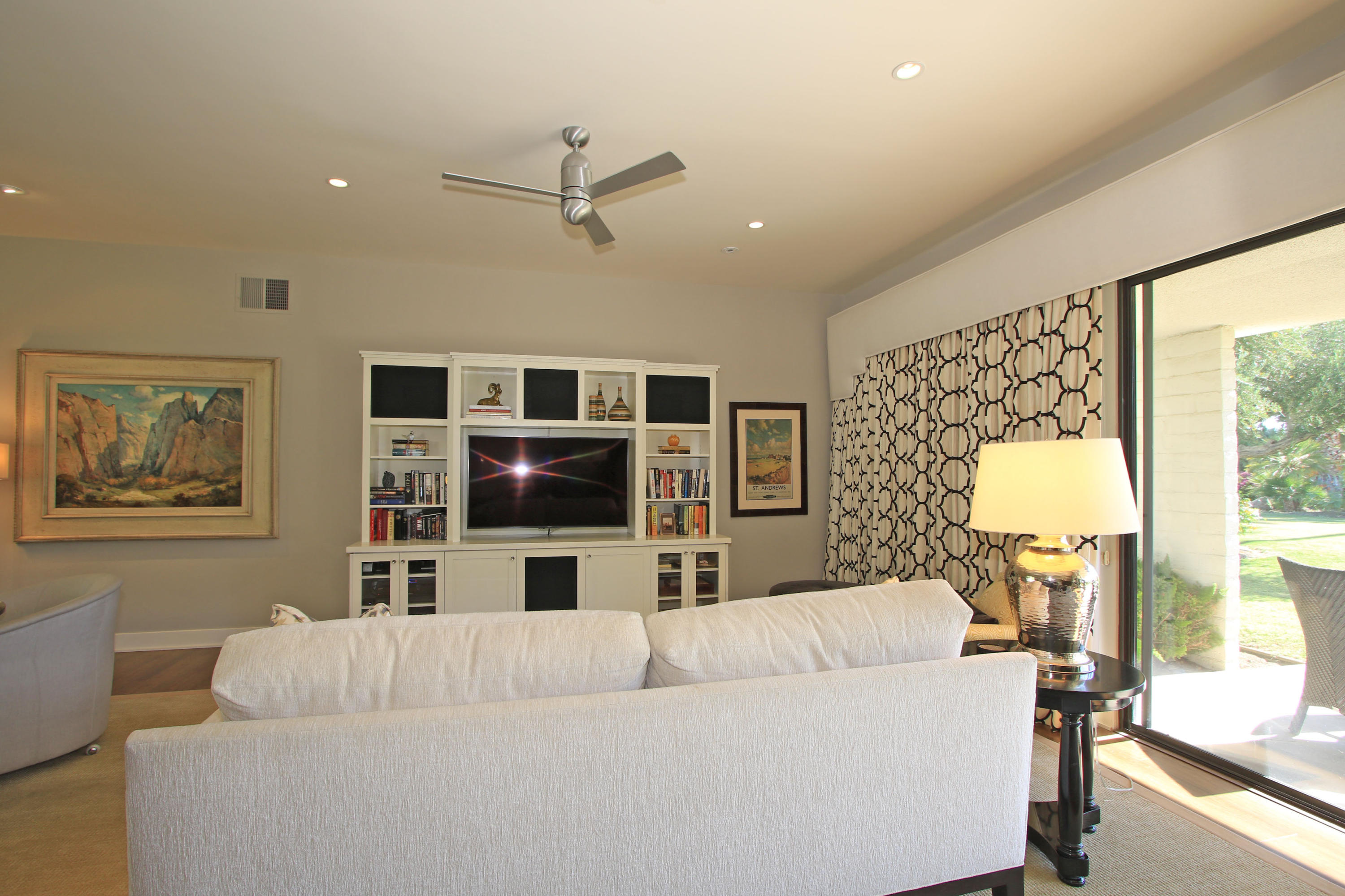 45760 Pawnee Road Indian Wells, CA 92210 - Photo 10 of 56 a living room with furniture and a flat screen tv