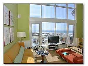 37 Compass Point Way, Unit 421 Inlet Beach, FL 32461 - Photo 3 of 8 a living room with furniture and a flat screen tv