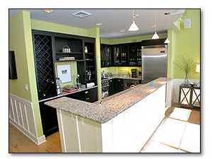 37 Compass Point Way, Unit 421 Inlet Beach, FL 32461 - Photo 6 of 8 a kitchen counter top space with granite countertop a sink and a refrigerator