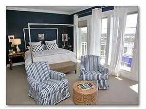 37 Compass Point Way, Unit 421 Inlet Beach, FL 32461 - Photo 7 of 8 a bed sitting in a bedroom next to a window