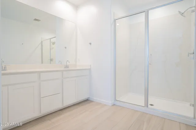 a white toilet sitting next to a shower