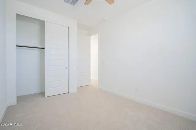 a bathroom with a toilet a sink a mirror and a bathtub