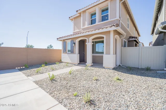 a view of a white house with a outdoor space