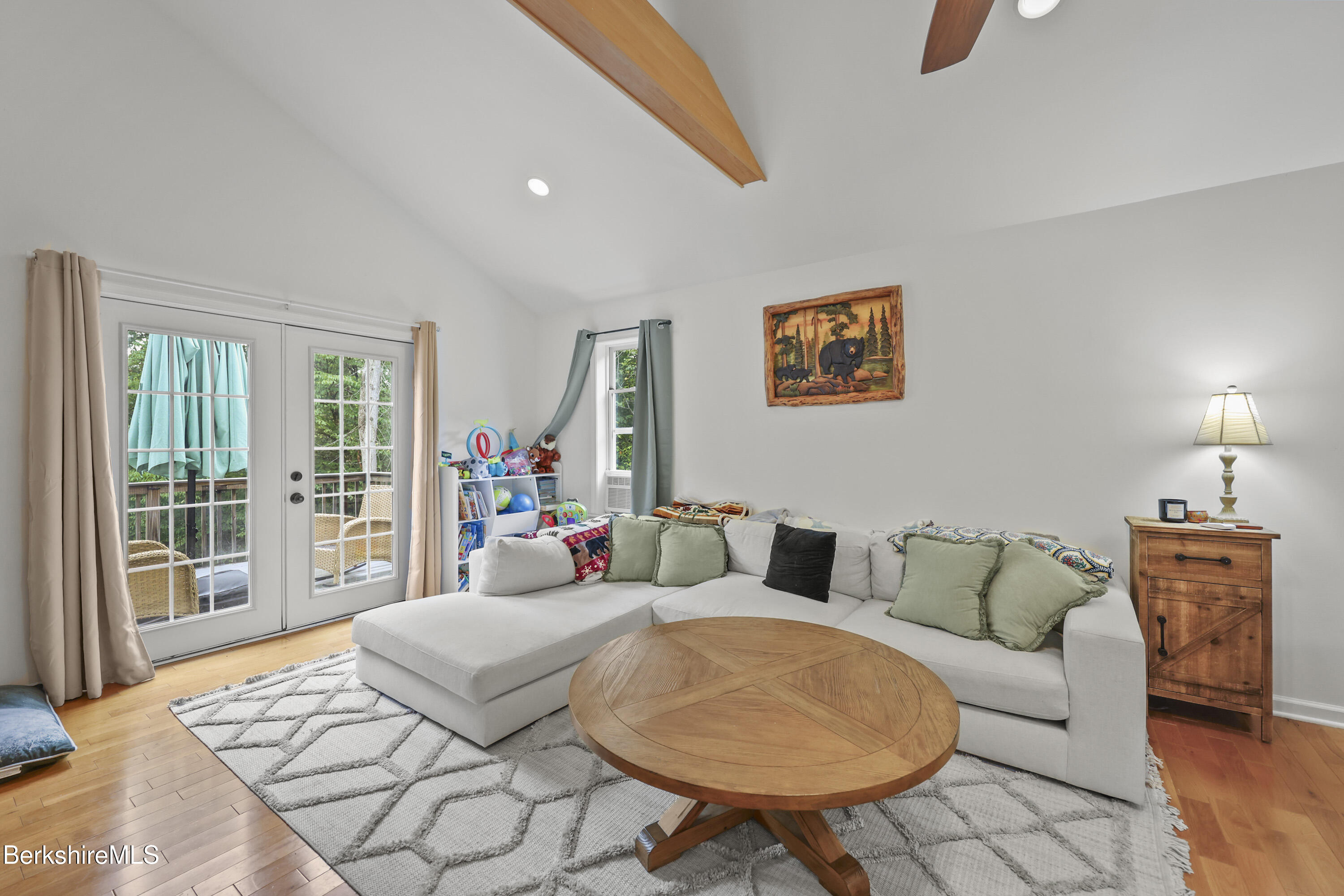 674 Benton Hill Road Becket, MA 01223 - Photo 13 of 61 a living room with furniture and a floor to ceiling window