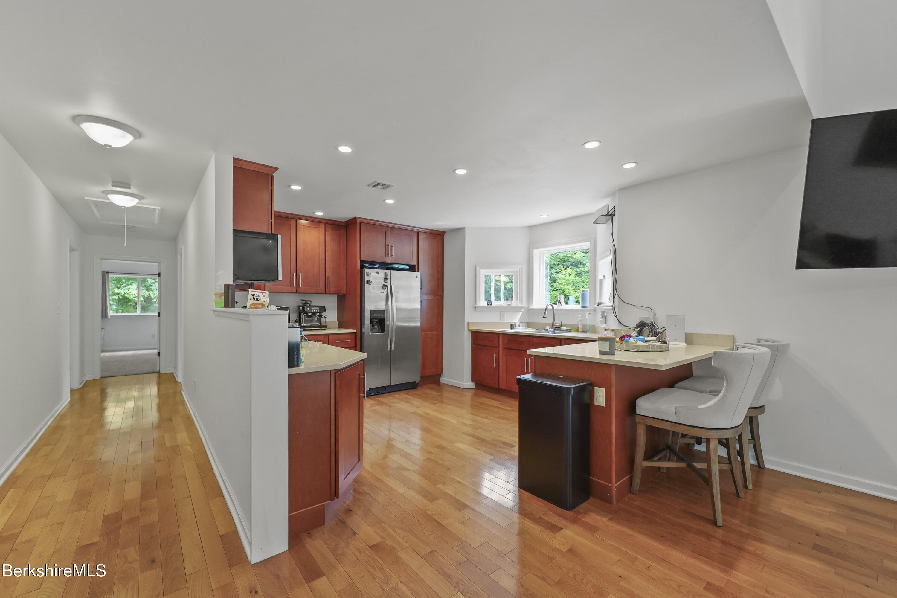 674 Benton Hill Road Becket, MA 01223 - Photo 17 of 61 a living room with stainless steel appliances kitchen island granite countertop furniture wooden floor and a view of kitchen