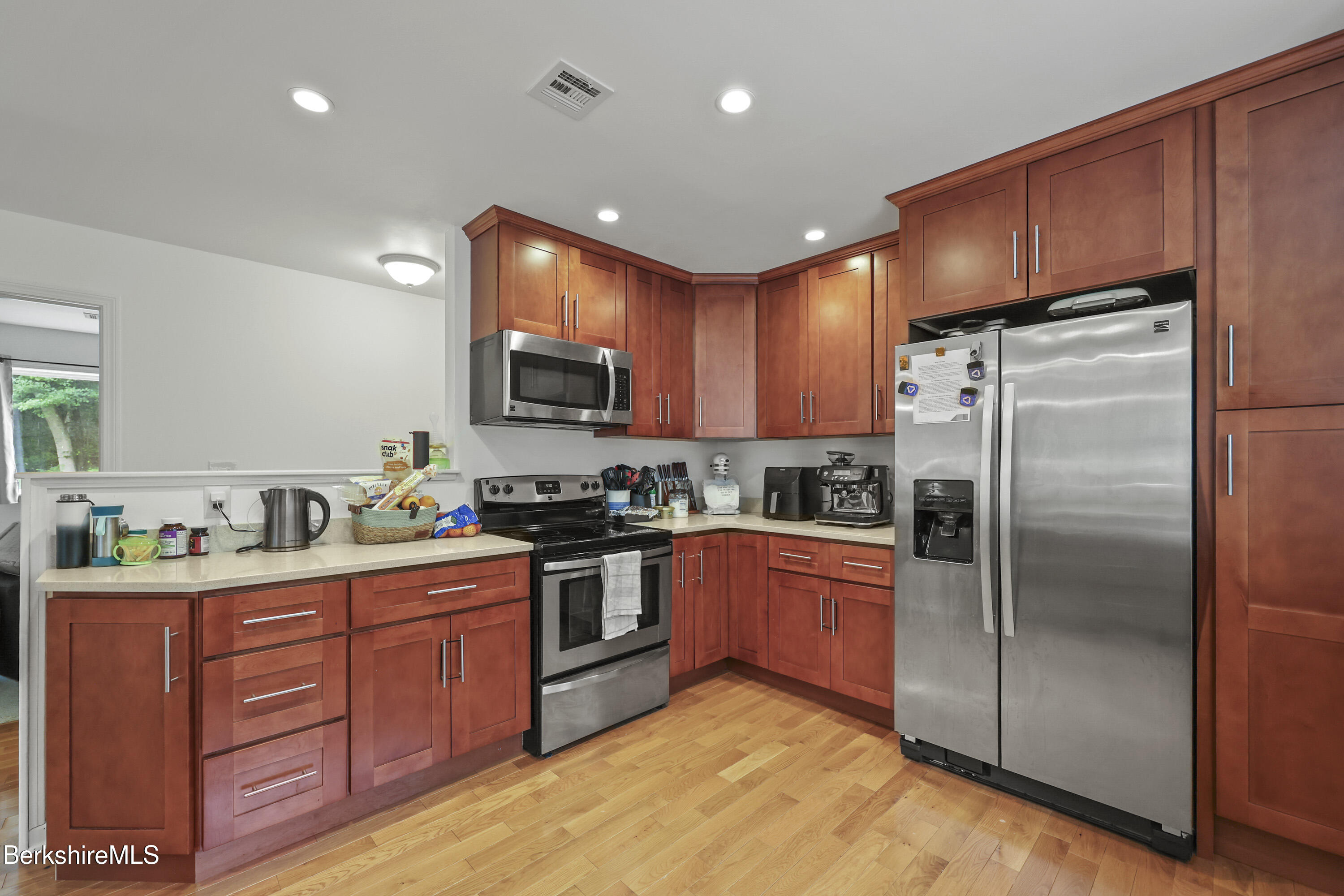 674 Benton Hill Road Becket, MA 01223 - Photo 19 of 61 a kitchen with stainless steel appliances granite countertop a refrigerator stove a sink and dishwasher