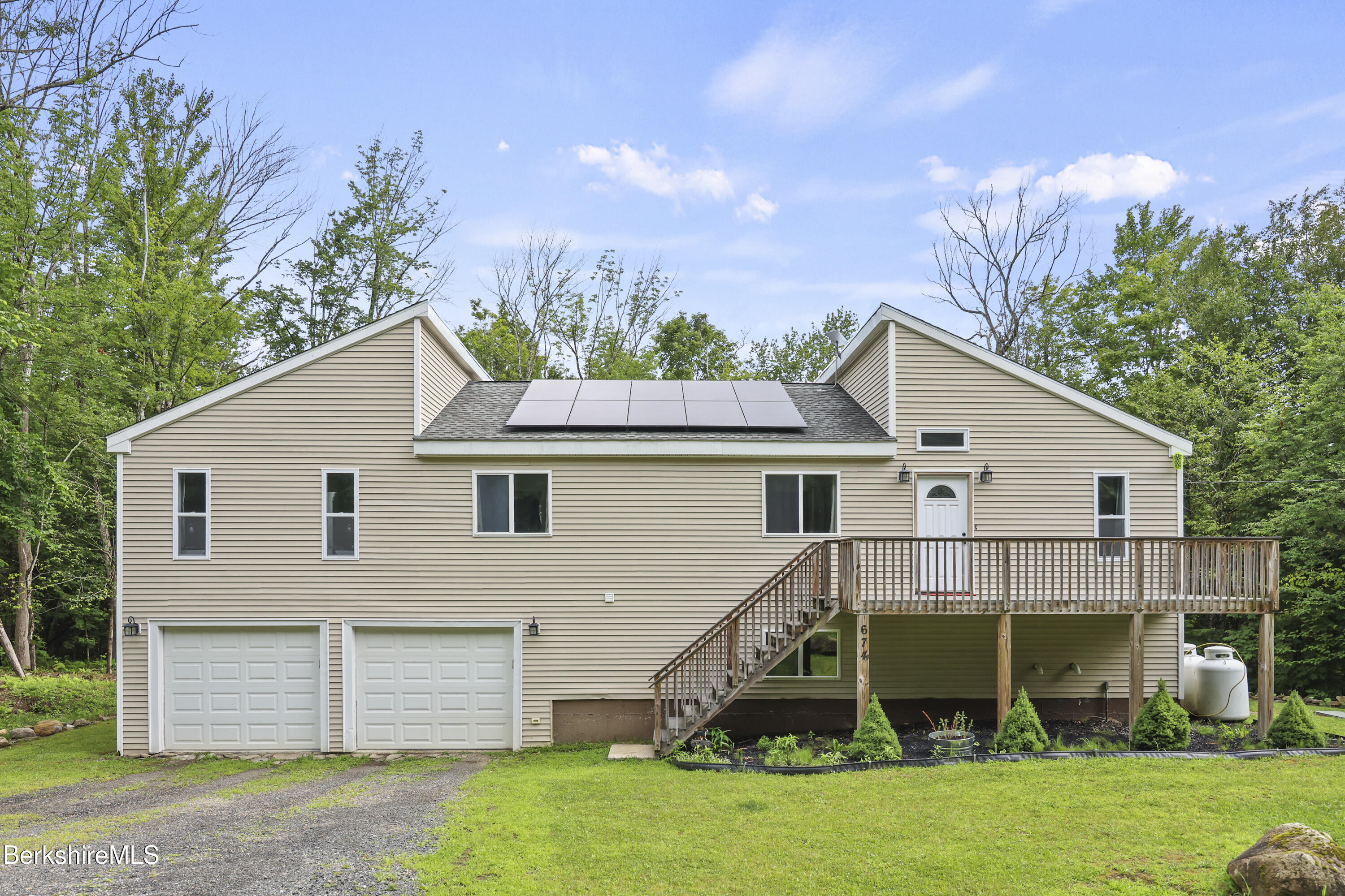 674 Benton Hill Road Becket, MA 01223 - Photo 2 of 61 a view of a house with a yard and potted plants