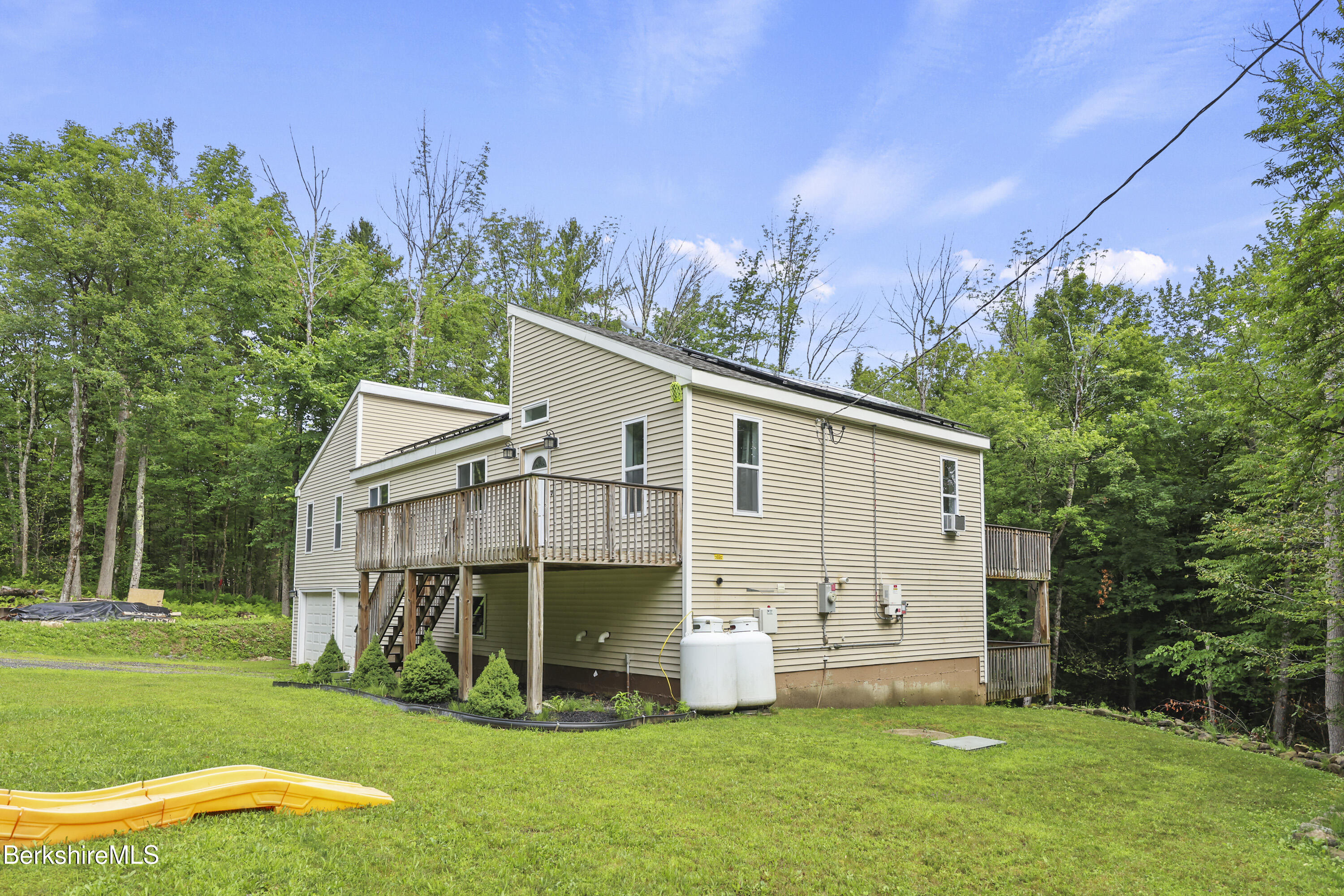 674 Benton Hill Road Becket, MA 01223 - Photo 3 of 61 a view of a back yard of the house