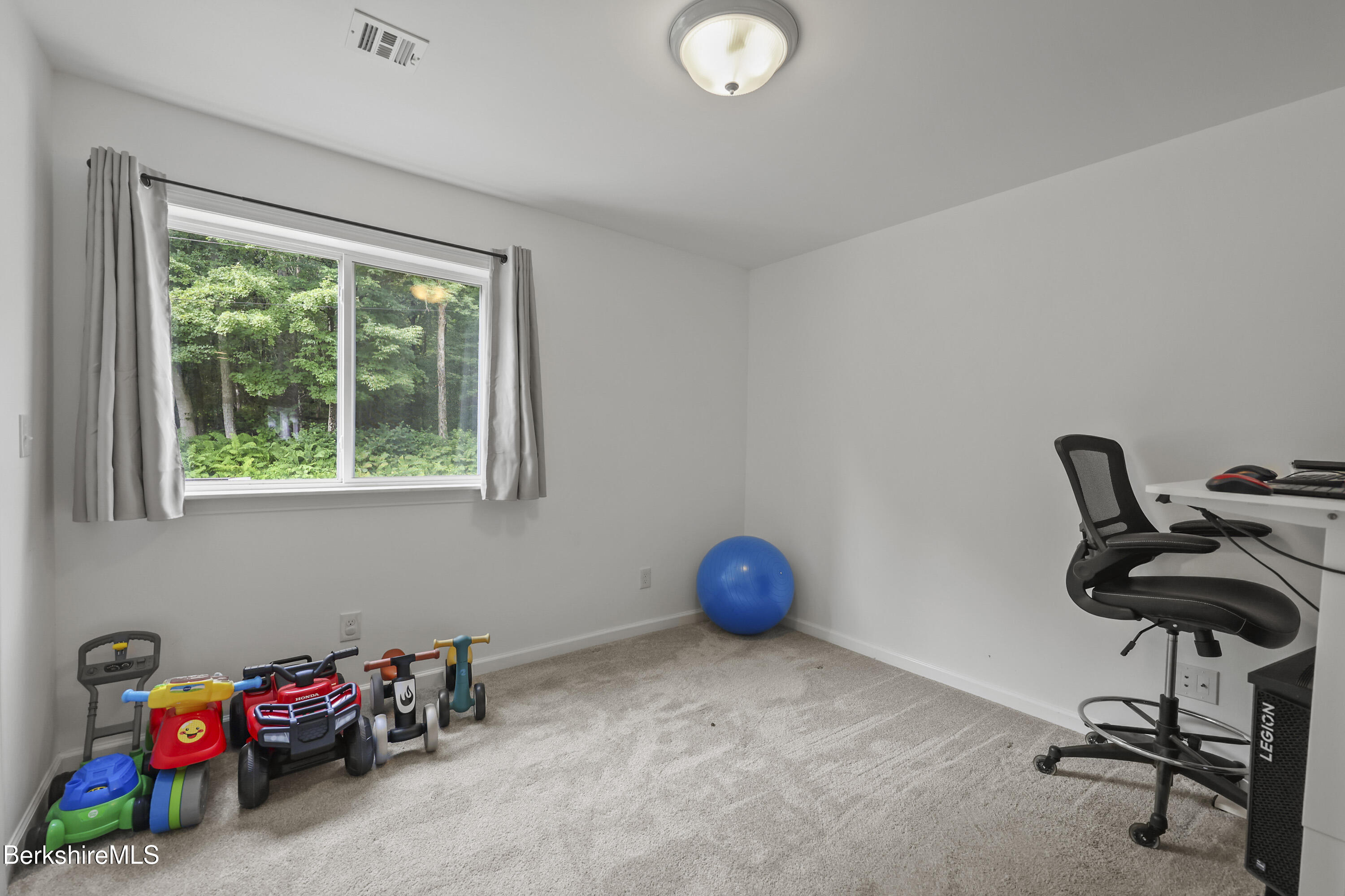 674 Benton Hill Road Becket, MA 01223 - Photo 31 of 61 a view of a workspace with furniture and a window