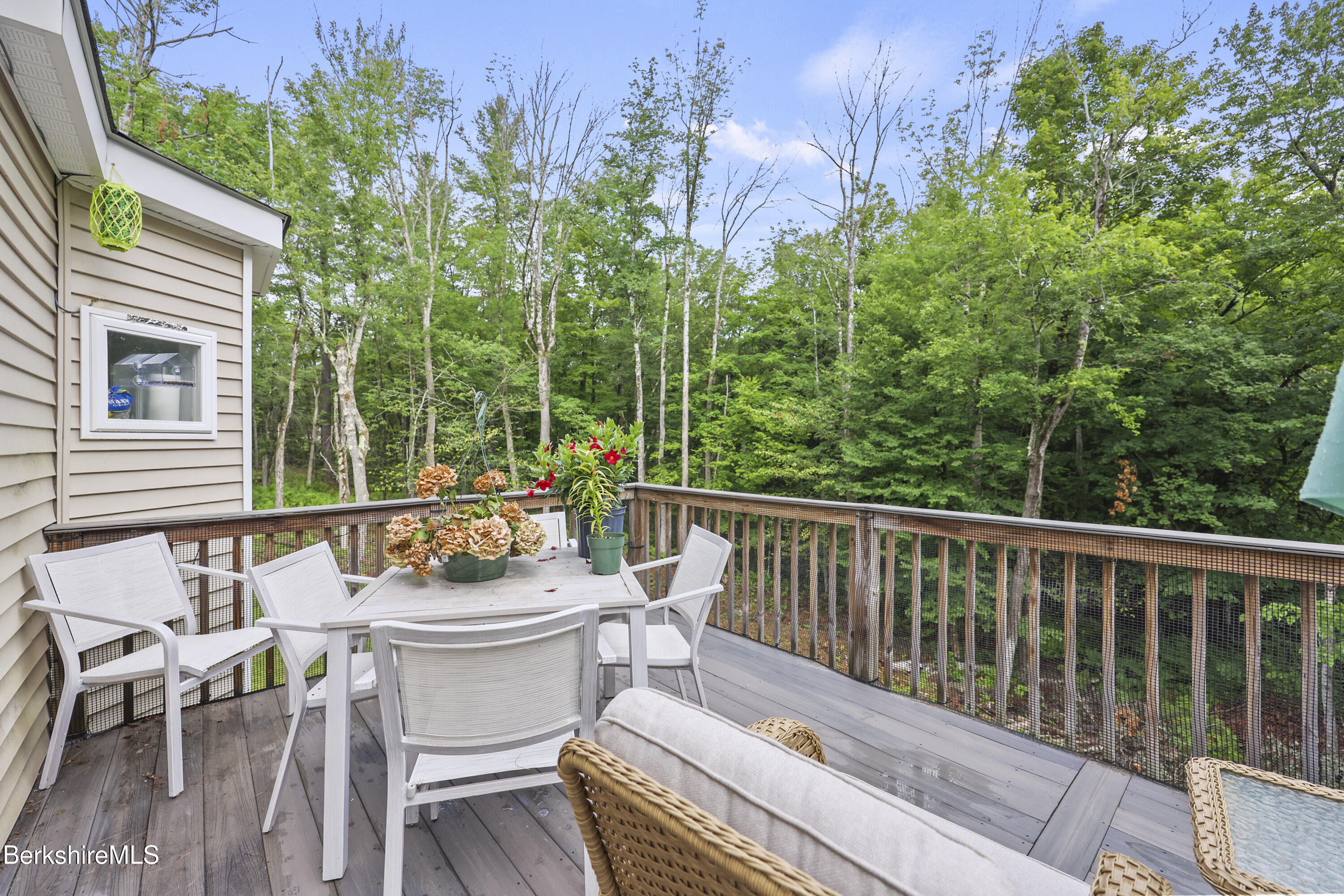 674 Benton Hill Road Becket, MA 01223 - Photo 39 of 61 a view of a chair and table in the balcony