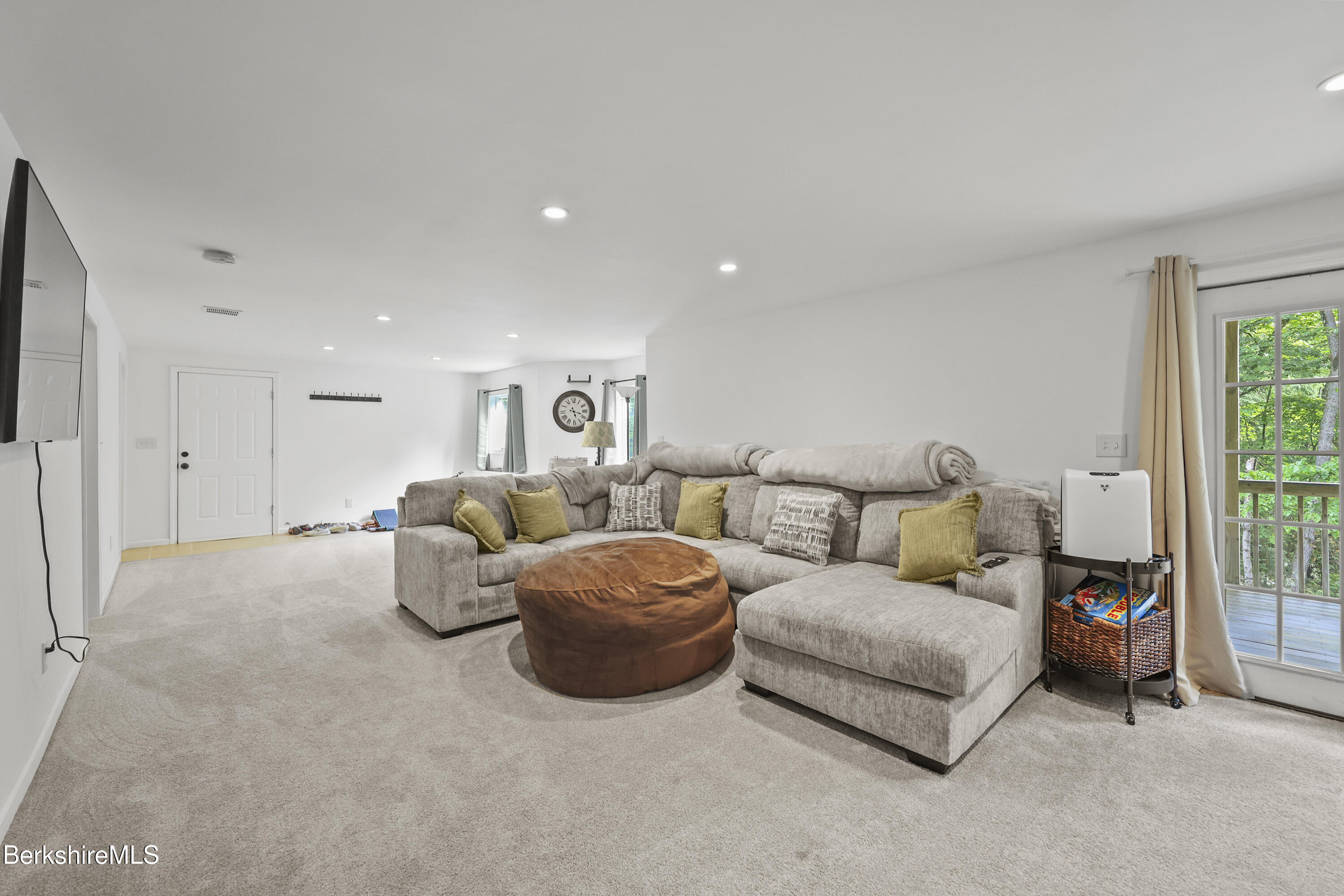 674 Benton Hill Road Becket, MA 01223 - Photo 42 of 61 a living room with furniture and a large window