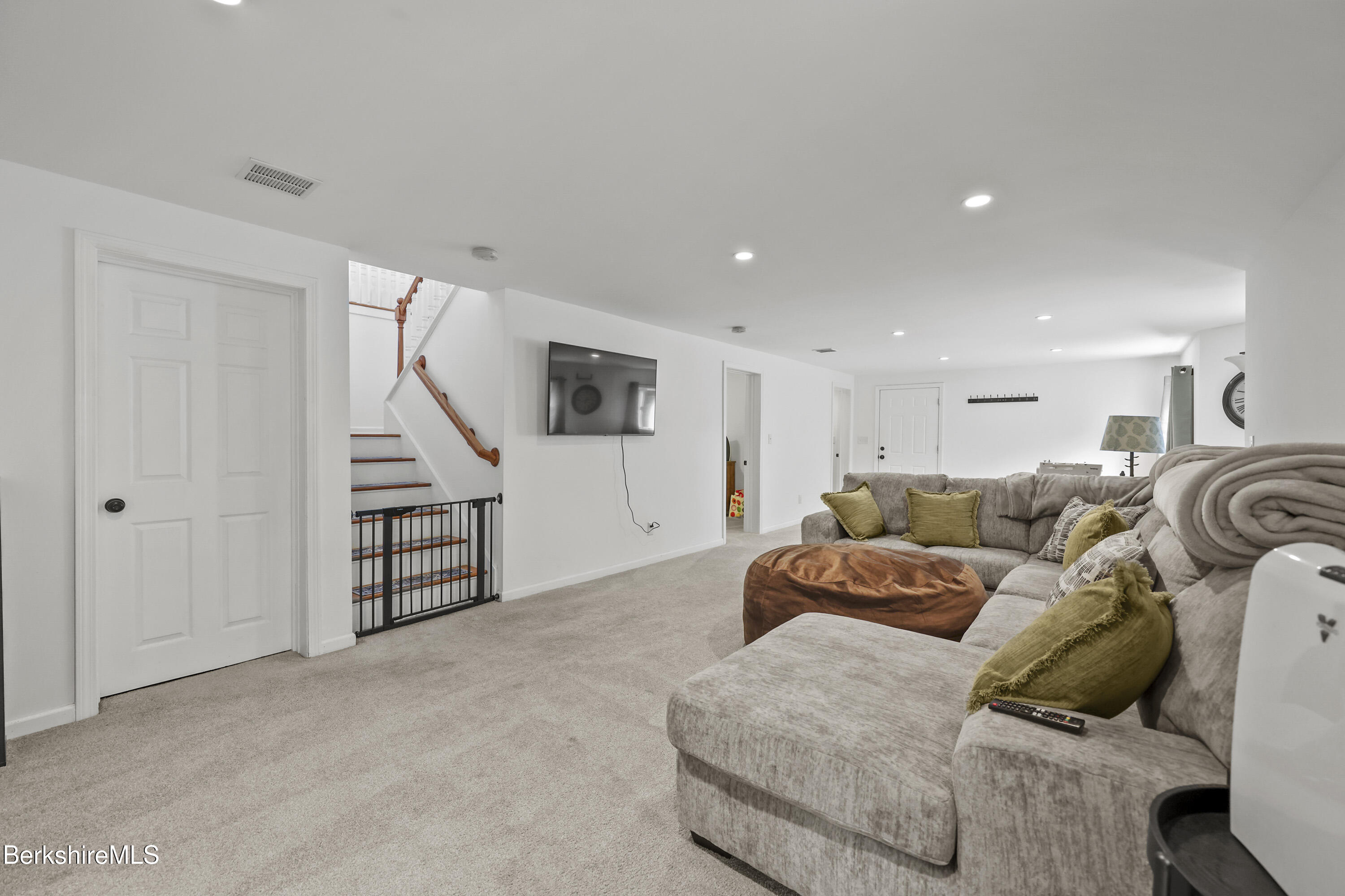 674 Benton Hill Road Becket, MA 01223 - Photo 44 of 61 a living room with furniture and a ceiling fan