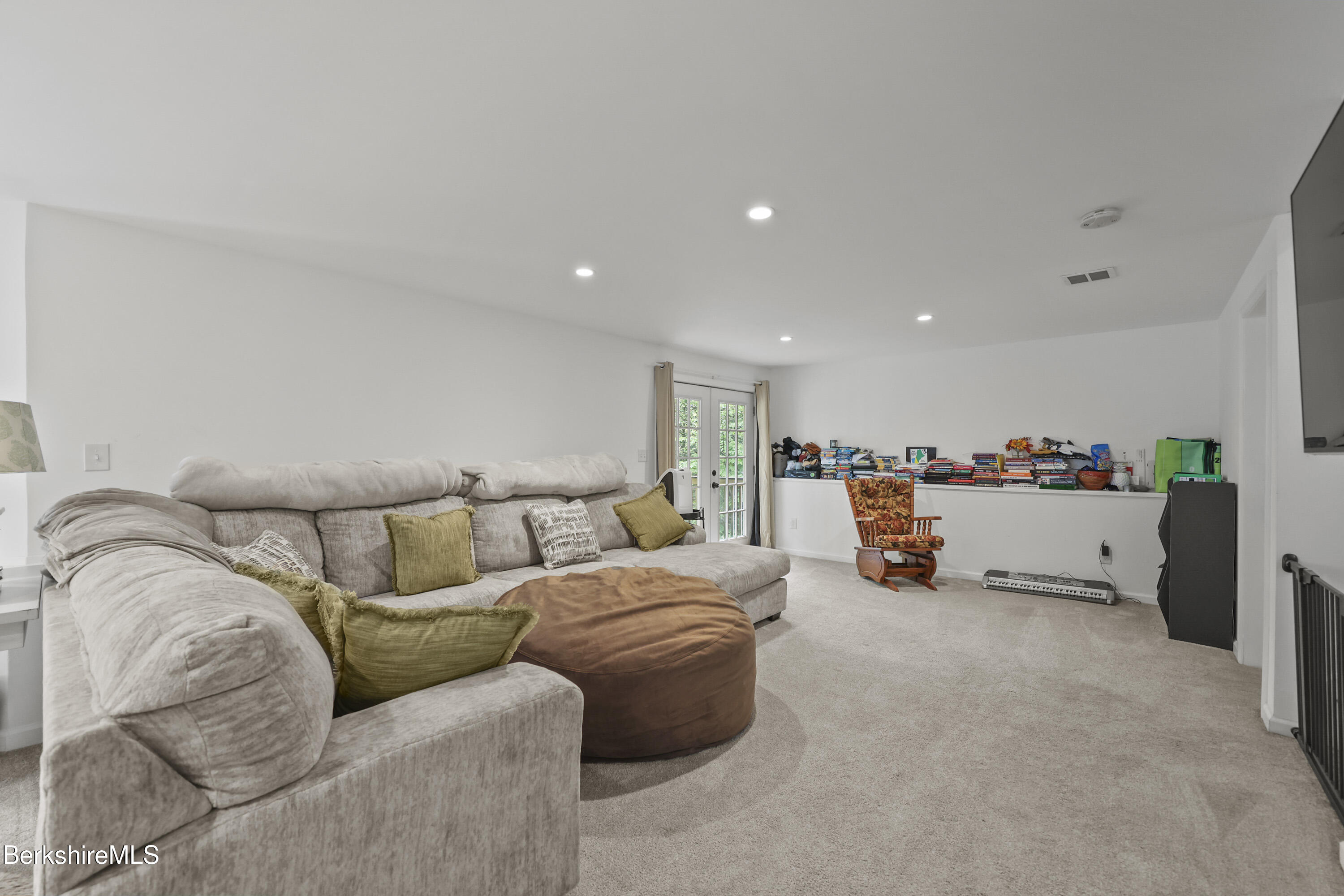 674 Benton Hill Road Becket, MA 01223 - Photo 45 of 61 a living room with furniture and a couch