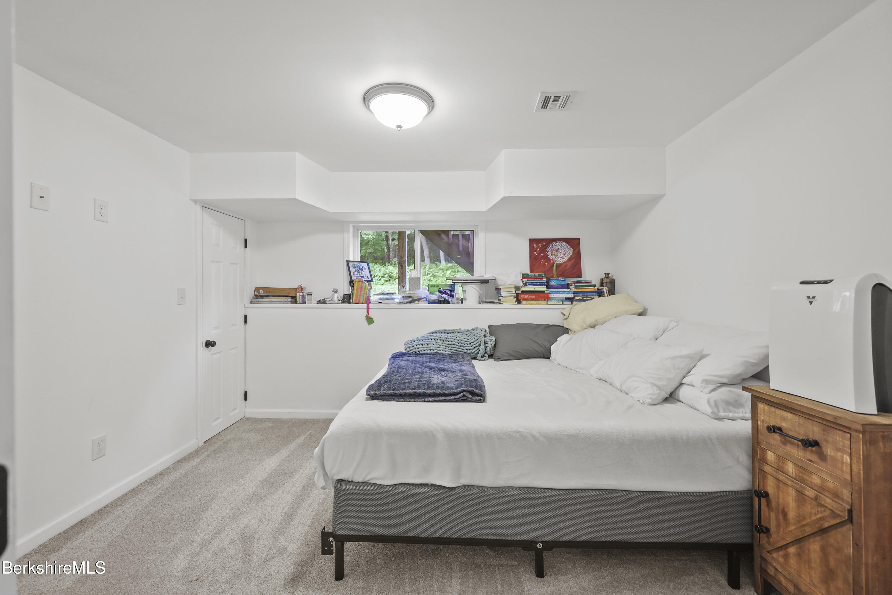 674 Benton Hill Road Becket, MA 01223 - Photo 50 of 61 a bedroom with a bed and window