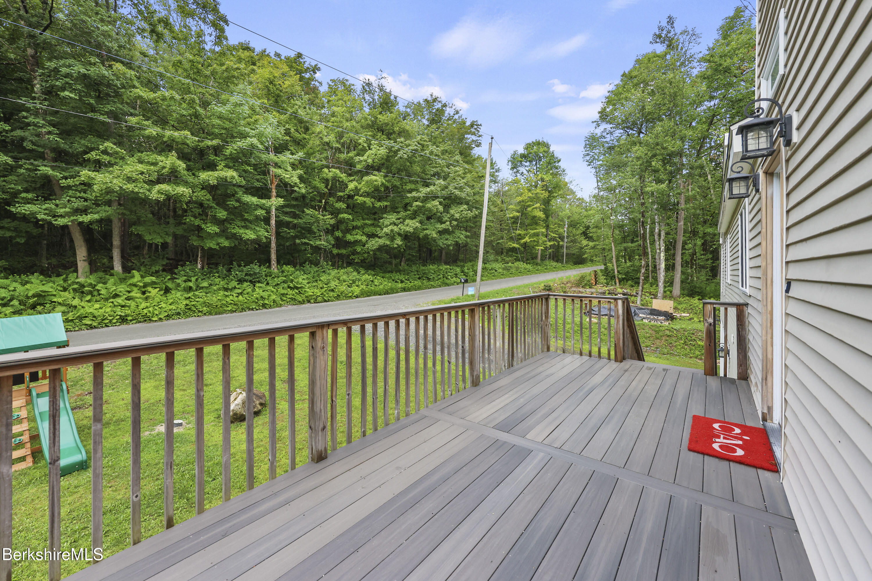 674 Benton Hill Road Becket, MA 01223 - Photo 7 of 61 a view of balcony with wooden floor and fence