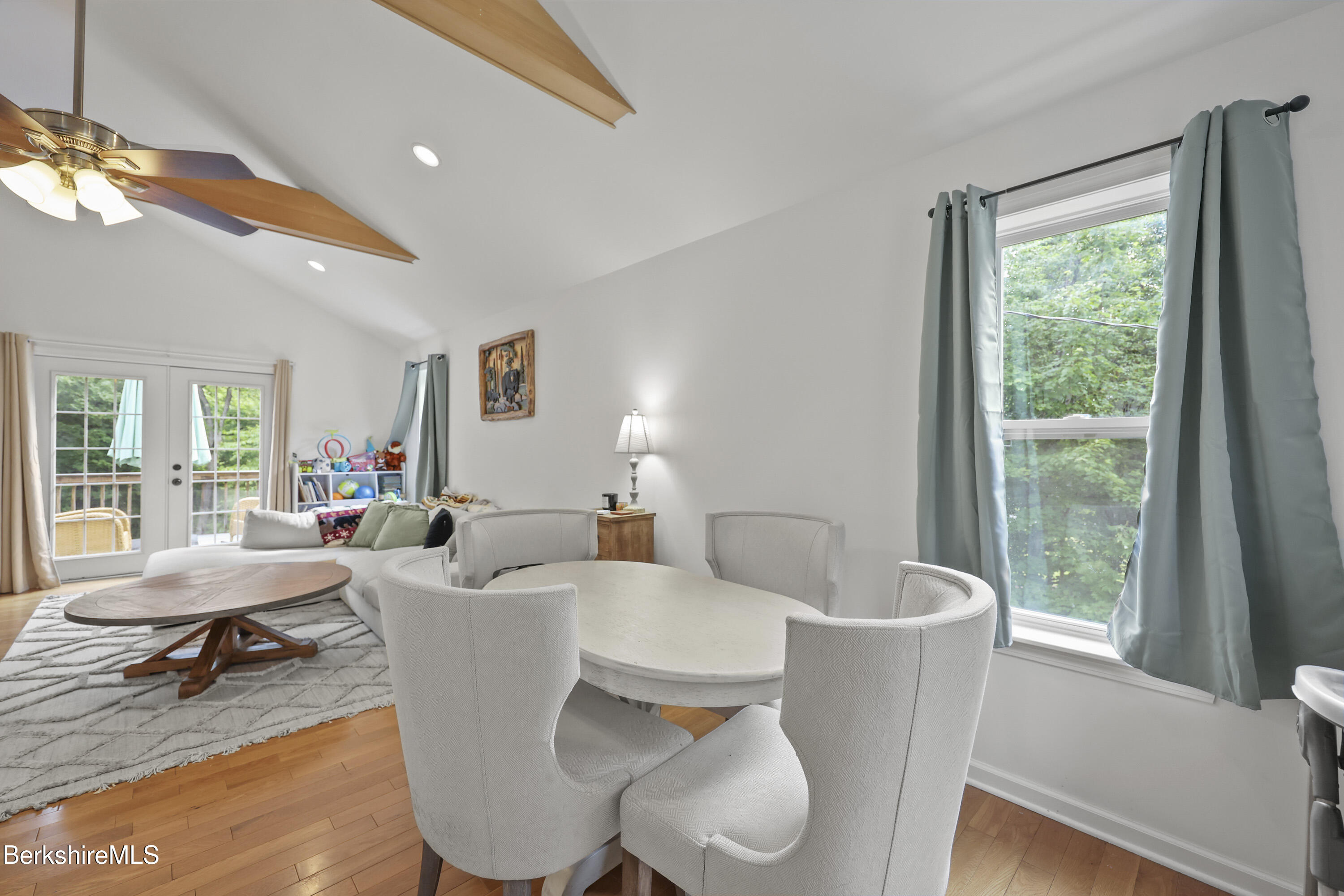 674 Benton Hill Road Becket, MA 01223 - Photo 8 of 61 a living room with furniture a lamp and a large window